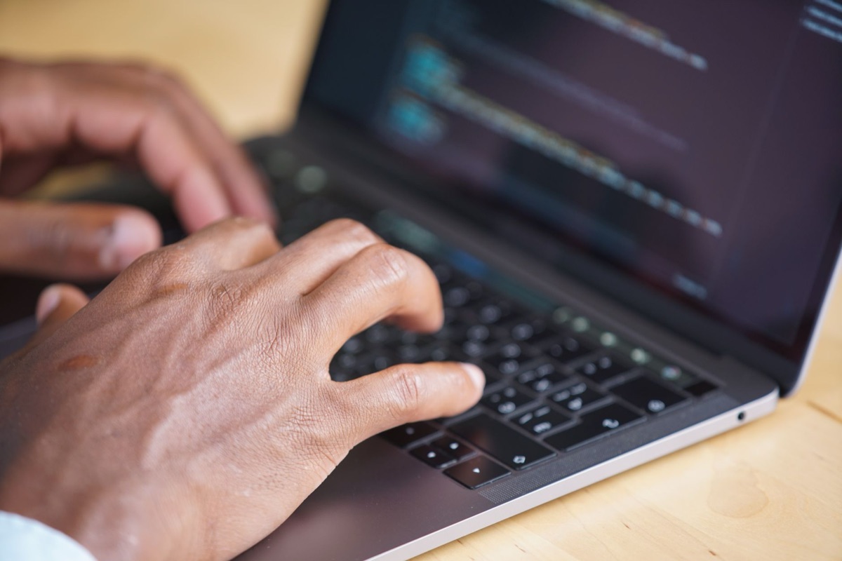 Person using ai tool for coding in tech environment