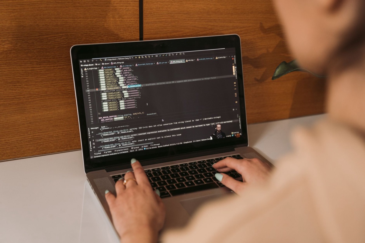 Business owner using laptop with CRM application open