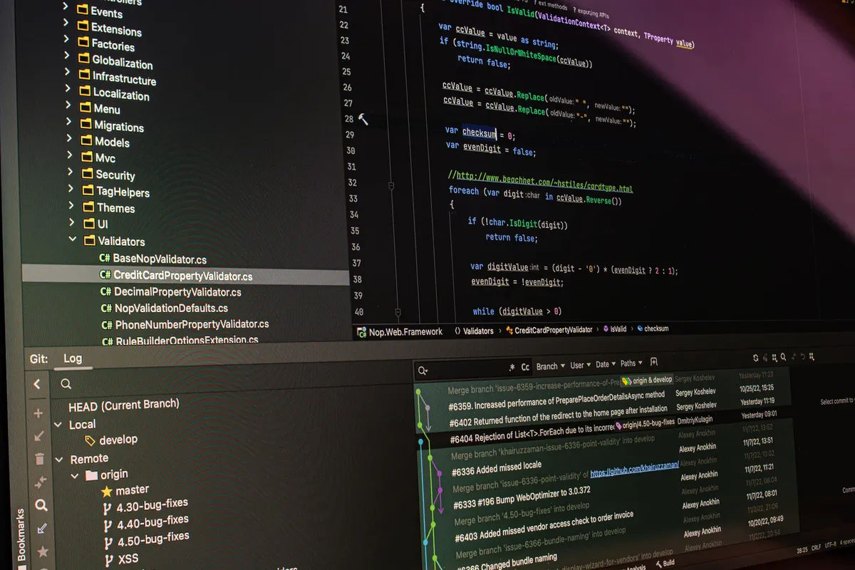 Close-up of software development tools displaying code and version control systems on a computer monitor.